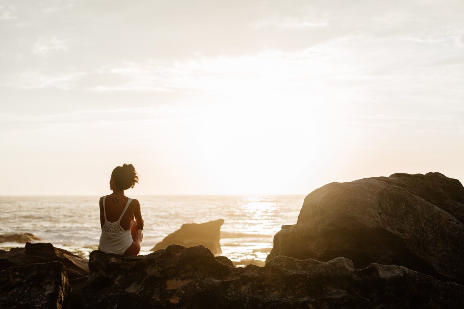 woman sitting on stone